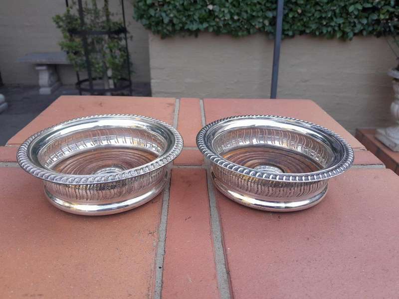 A 20th Century Pair Of Mappin & Webb Silver Plated Wine Coasters