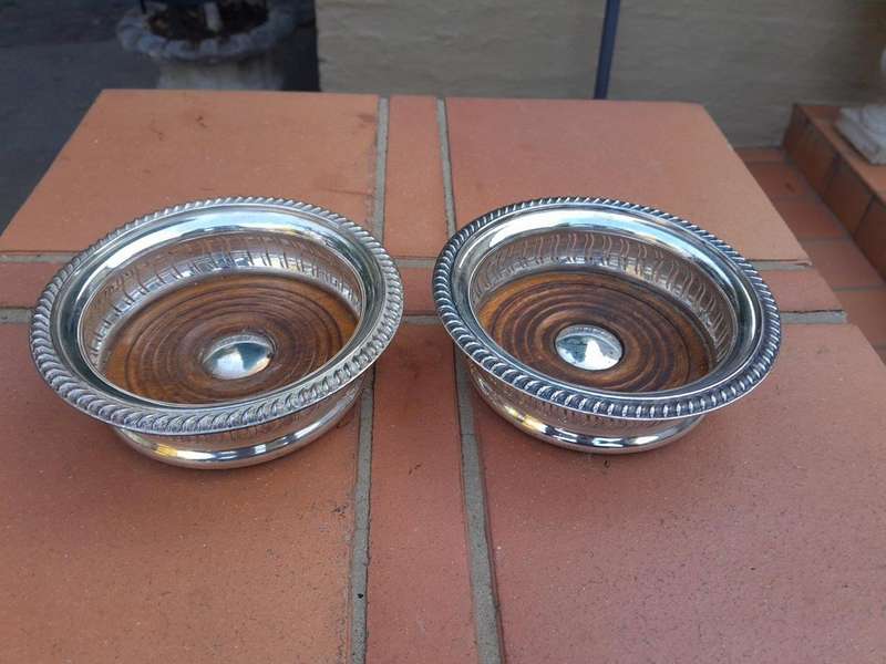 A 20th Century Pair Of Mappin & Webb Silver Plated Wine Coasters