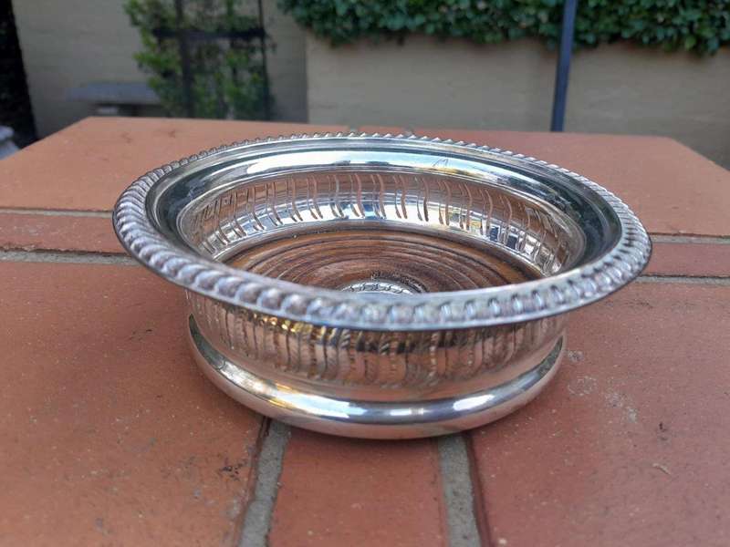A 20th Century Pair Of Mappin & Webb Silver Plated Wine Coasters