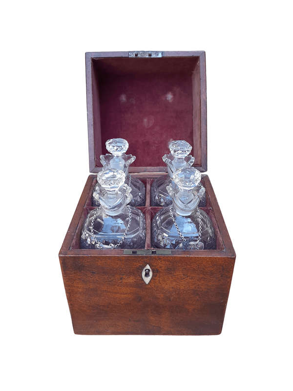 An 18th / Early 19th Century Georgian Mahogany Tantalus With Four Cut Glass Decanters And Three G...