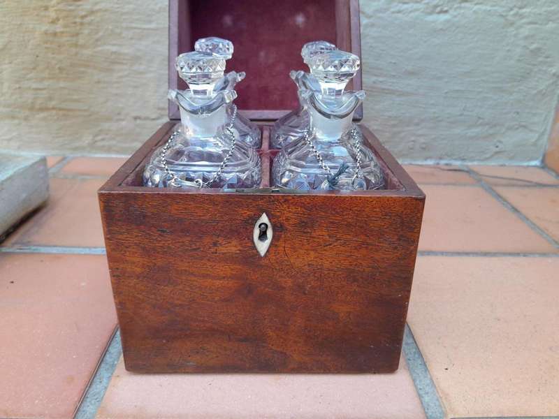 An 18th / Early 19th Century Georgian Mahogany Tantalus With Four Cut Glass Decanters And Three G...