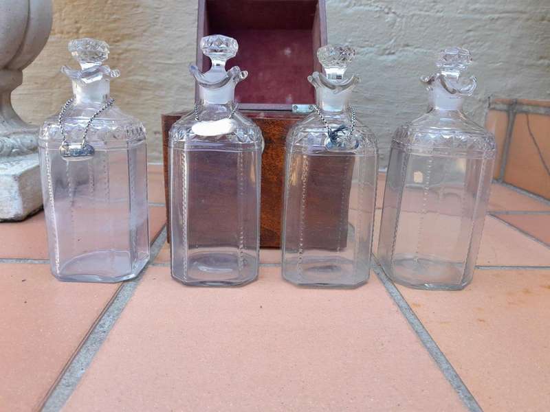An 18th / Early 19th Century Georgian Mahogany Tantalus With Four Cut Glass Decanters And Three G...