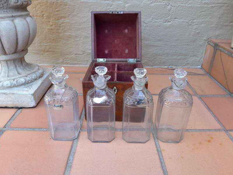 An 18th / Early 19th Century Georgian Mahogany Tantalus With Four Cut Glass Decanters And Three G...