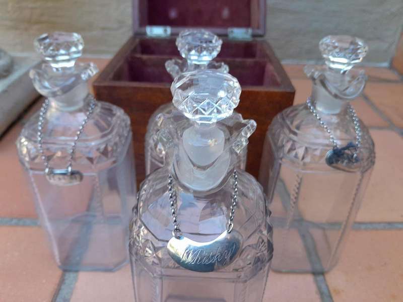 An 18th / Early 19th Century Georgian Mahogany Tantalus With Four Cut Glass Decanters And Three G...