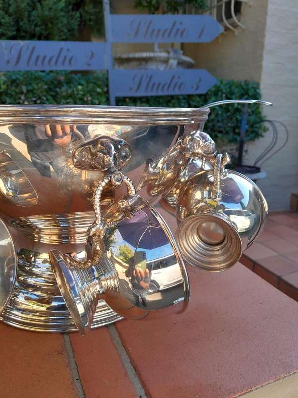 A 20th Century A1 Silver-Plate Punch Bowl With Eight Cups And Hooks And Ladle With Elephant Head