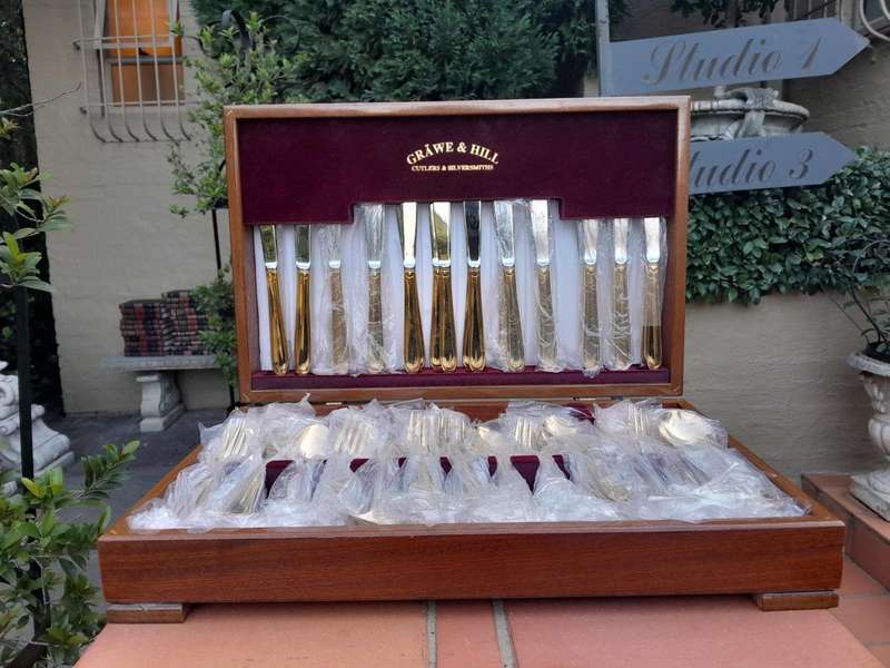 A Grawe And Hill Gold-Plated Cutlery Set With Maroon Lining In A Canteen