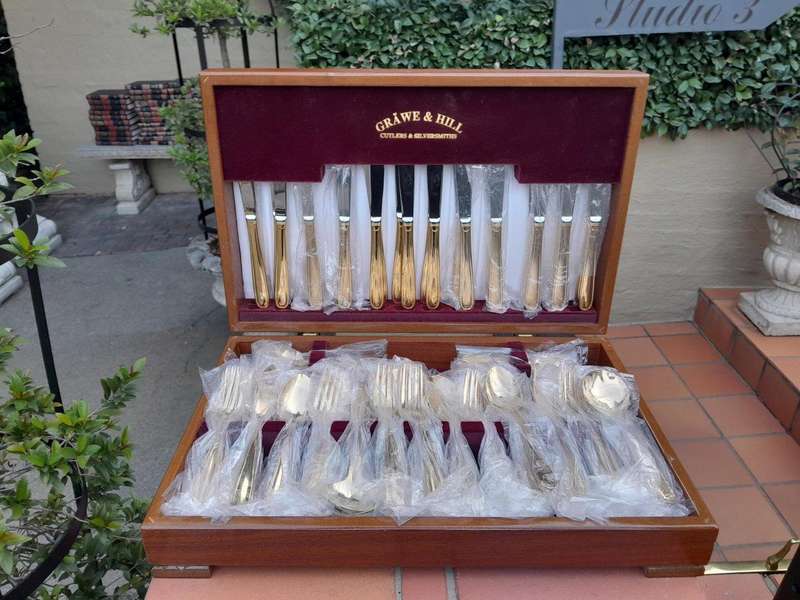 A Grawe And Hill Gold-Plated Cutlery Set With Maroon Lining In A Canteen