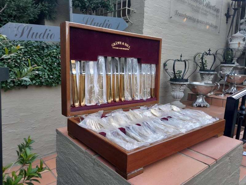 A Grawe And Hill Gold-Plated Cutlery Set With Maroon Lining In A Canteen