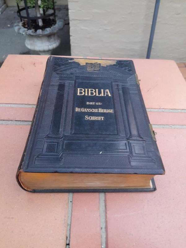 A Leather Bound Bible With Brass Clasps And Mounts