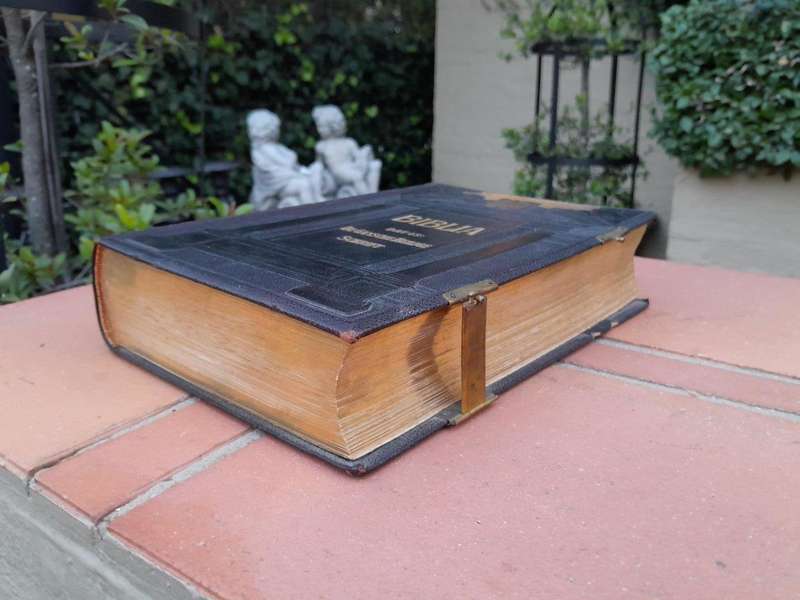 A Leather Bound Bible With Brass Clasps And Mounts