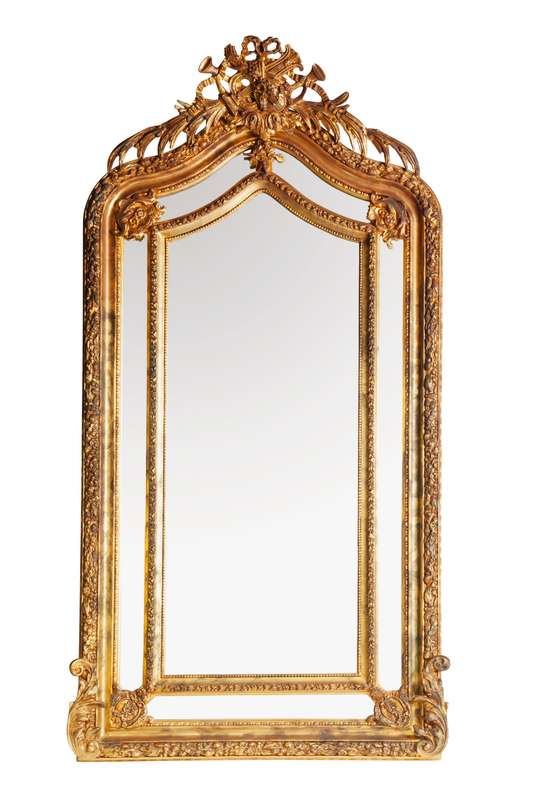 Ornate carved and gilded Bevelled mirror