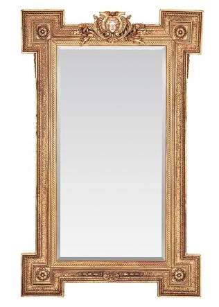A Large Ornately Carved and Gilt Wood Bevelled Mirror