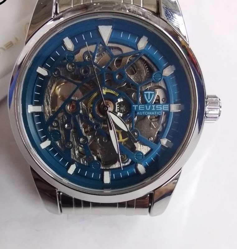 R30 courier.. Retail: R2,399.00 TEVISE ® Men`s Skeleton II Classic Steel Silver/blue Watch BRAND NEW