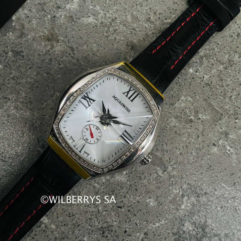 must see**rrp: R13,300.00 AQUASWISS Womens genuine diamond 0.65ctw Ice Pyramid Glass watch