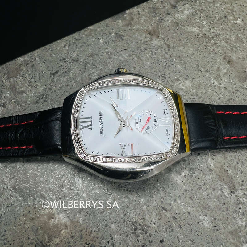 must see**rrp: R13,300.00 AQUASWISS Womens genuine diamond 0.65ctw Ice Pyramid Glass watch