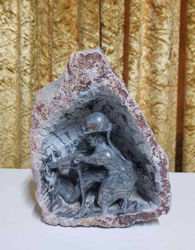 Vintage hand carved soap stone coal miner sculpture