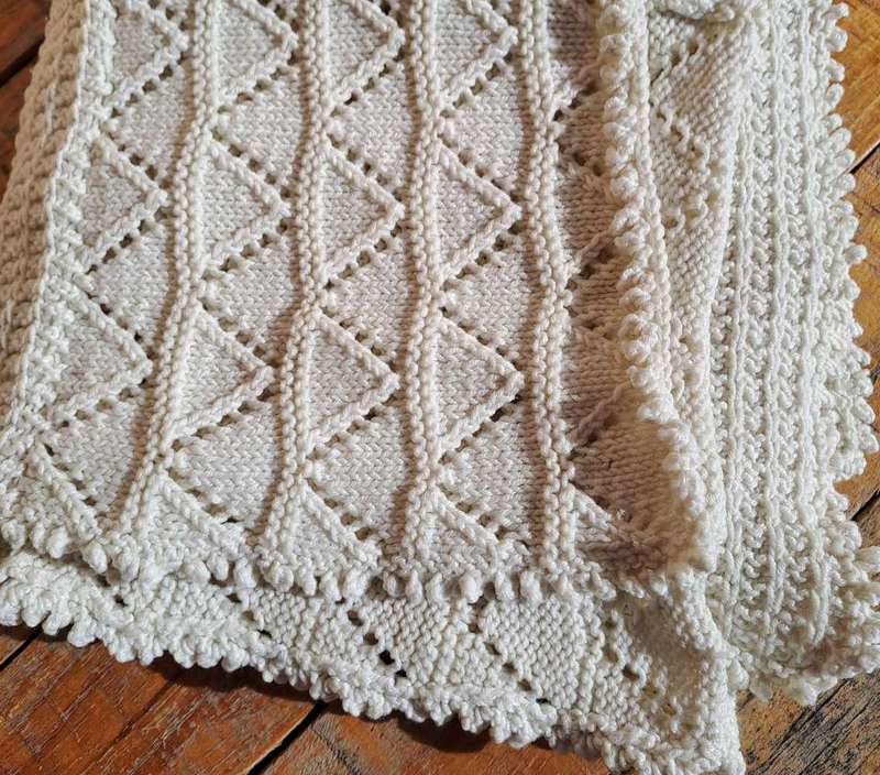 Lovely knitted cot blanket 100 x 90cm