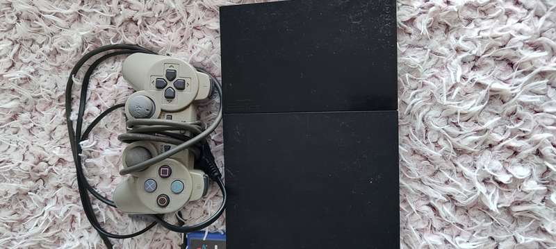 Playstation 2 with remote and game