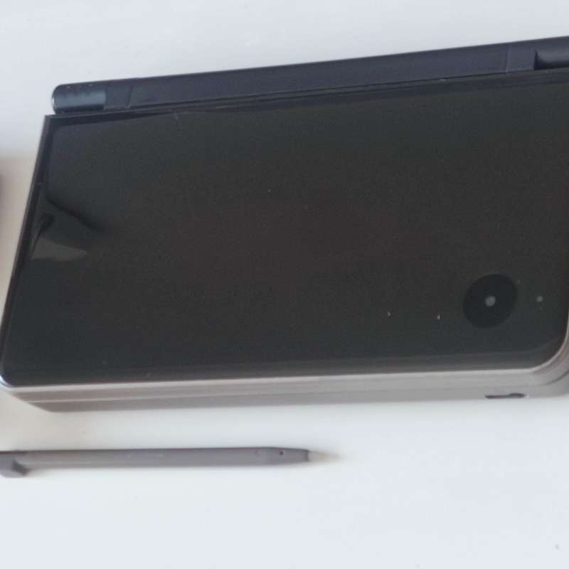 Nintendo Dsi XL console with charger