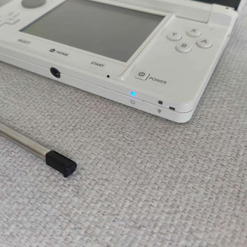 Nintendo 3ds console with charger and stylus