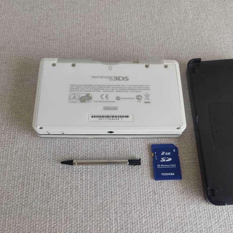 Nintendo 3ds console with charger and stylus