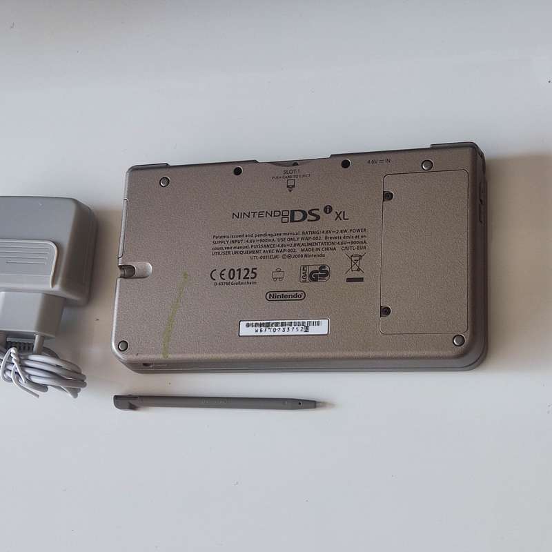Nintendo Dsi XL console with charger