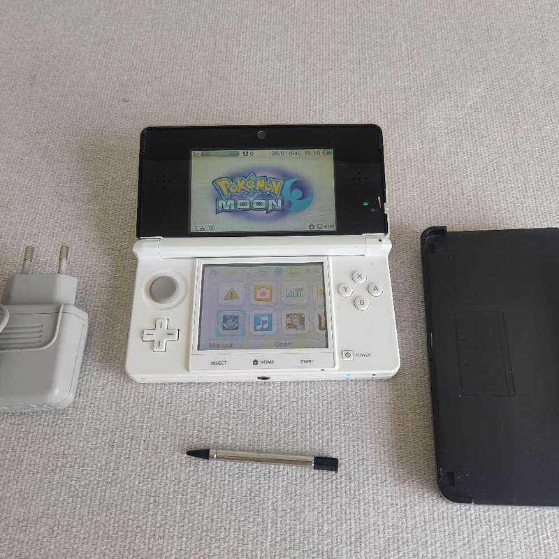 Nintendo 3ds console with charger and stylus