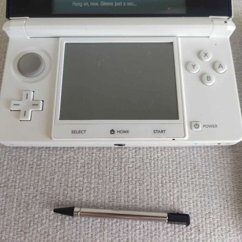 Nintendo 3ds console with charger and stylus
