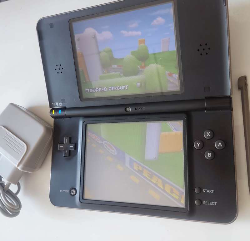 Nintendo Dsi XL console with charger
