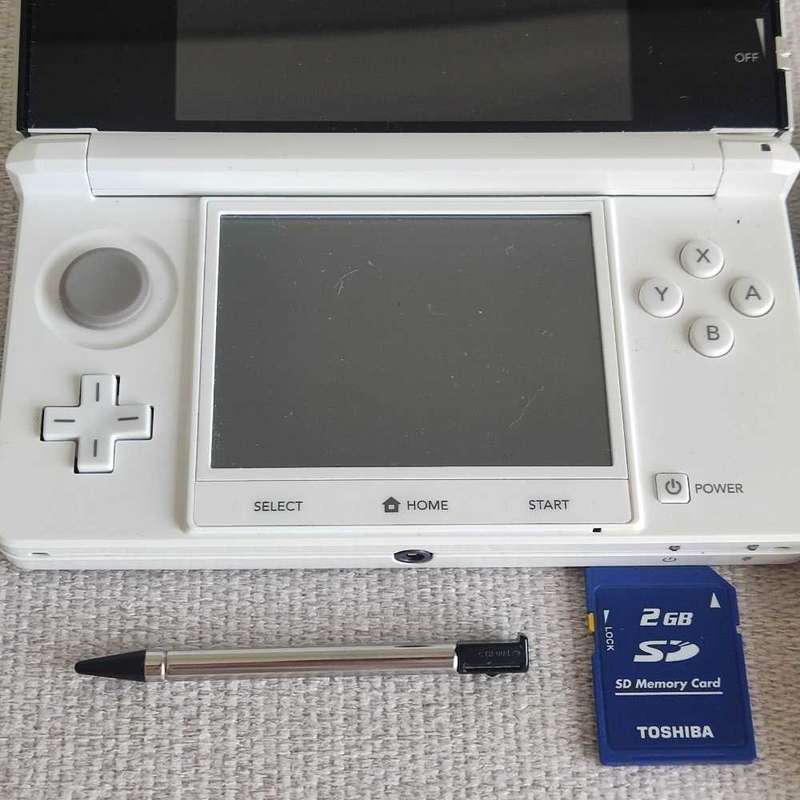 Nintendo 3ds console with charger and stylus