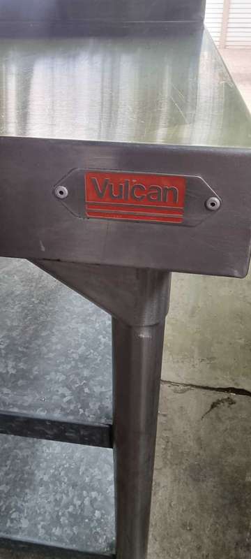 Stainless steel butcher table (Vulcan) with shelves and splashback.