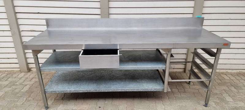 Stainless steel butcher table (Vulcan) with shelves and splashback.