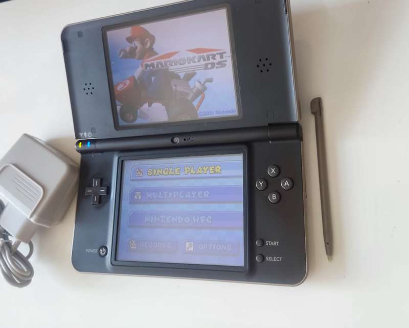 Nintendo Dsi XL console with charger
