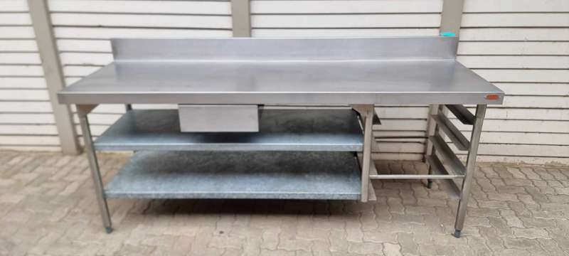 Stainless steel butcher table (Vulcan) with shelves and splashback.