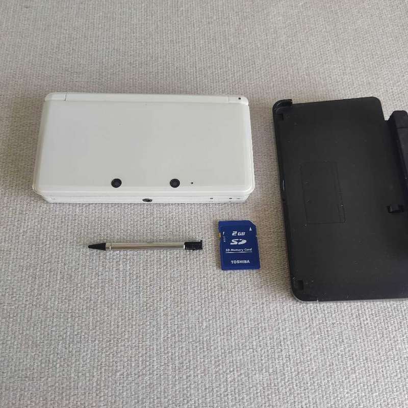 Nintendo 3ds console with charger and stylus