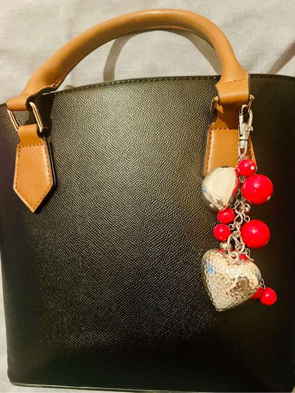 Bag charm silver and red bead detail