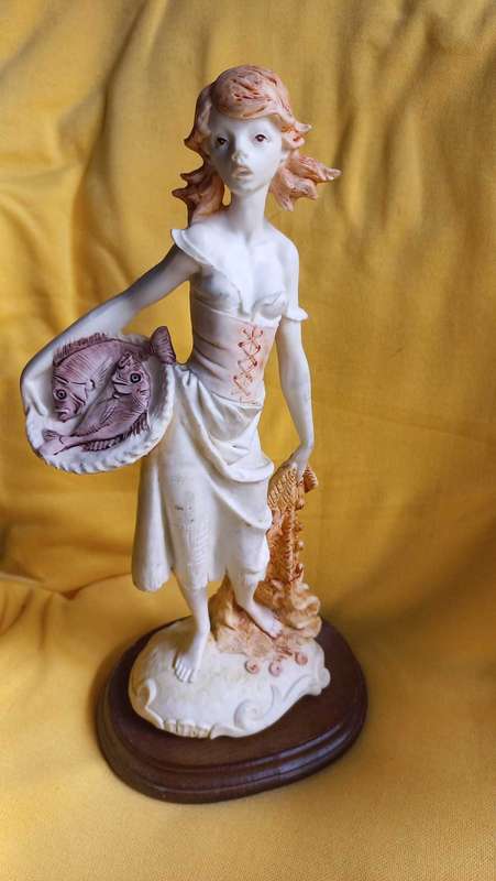 Vintage statue / sculpture of young girl holding a basket of fish - Simonelli  ?