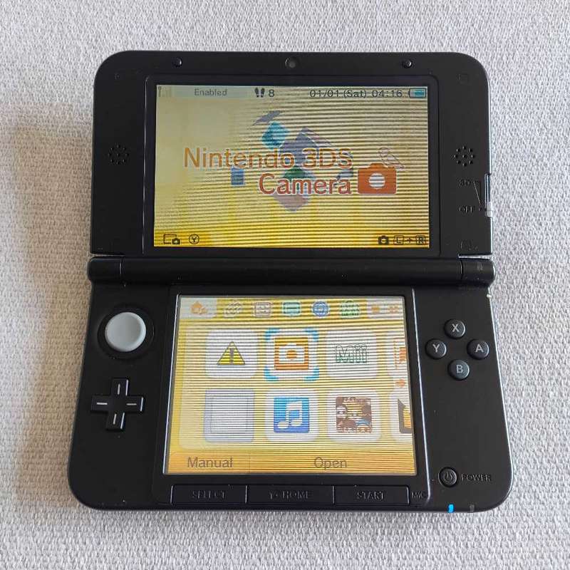 Nintendo 3Ds XL console with original charger