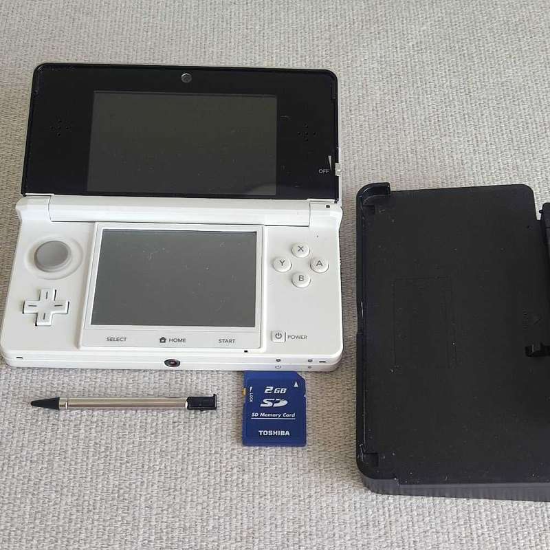 Nintendo 3ds console with charger and stylus