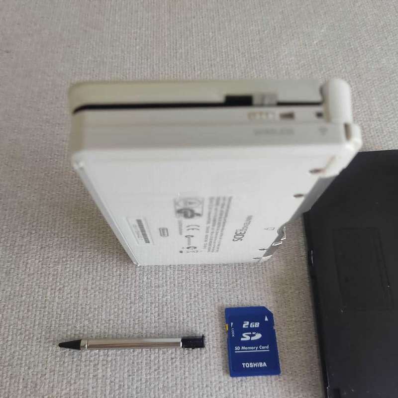 Nintendo 3ds console with charger and stylus