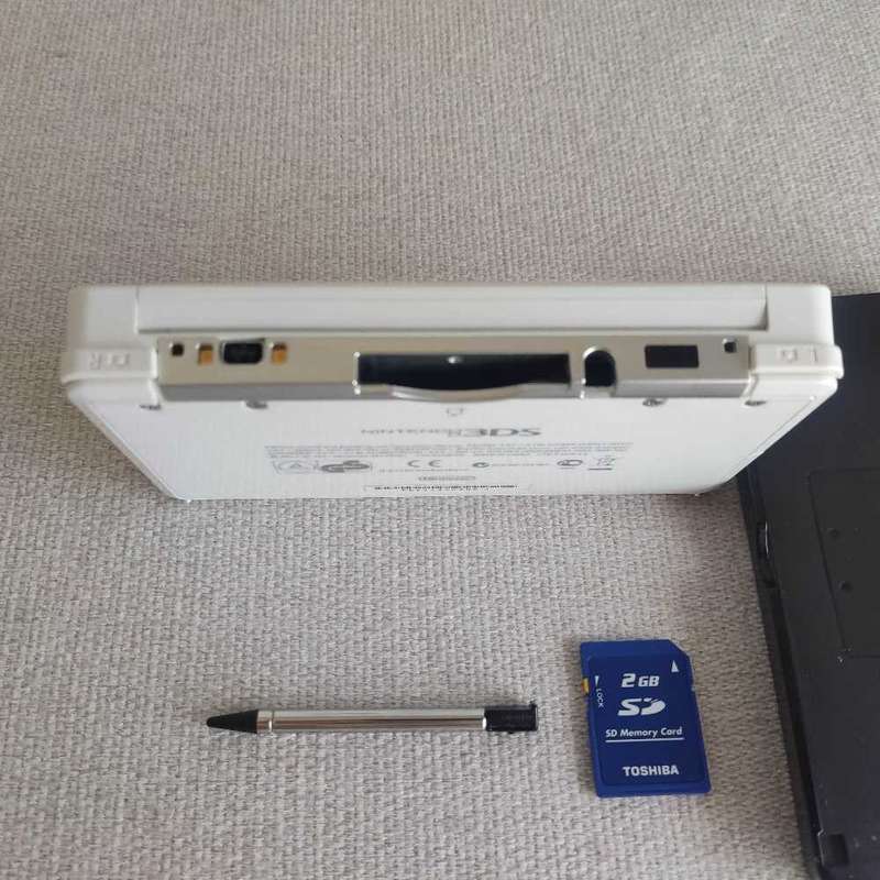 Nintendo 3ds console with charger and stylus