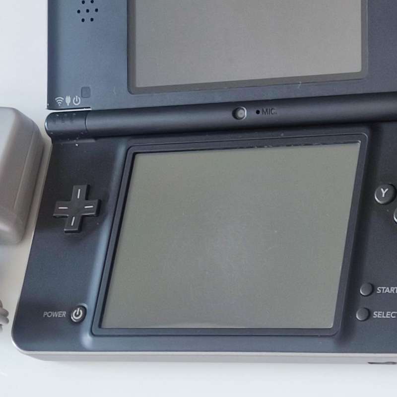 Nintendo Dsi XL console with charger