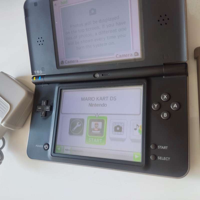 Nintendo Dsi XL console with charger
