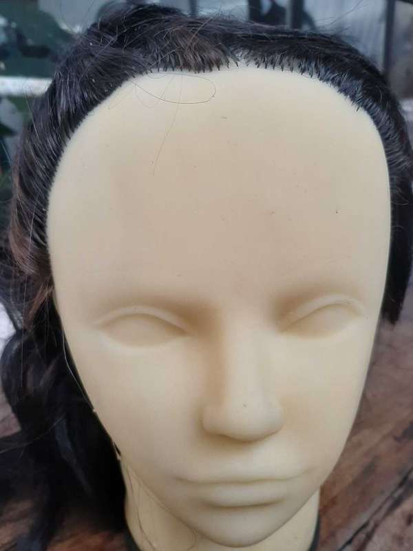 Display head mannequins with attached hair