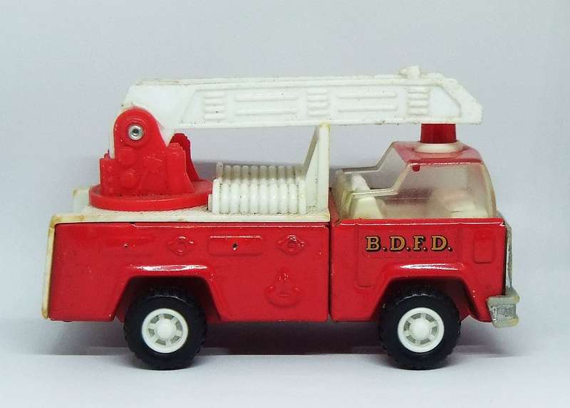 A VINTAGE MOSTLY METAL TOY FIRE TRUCK