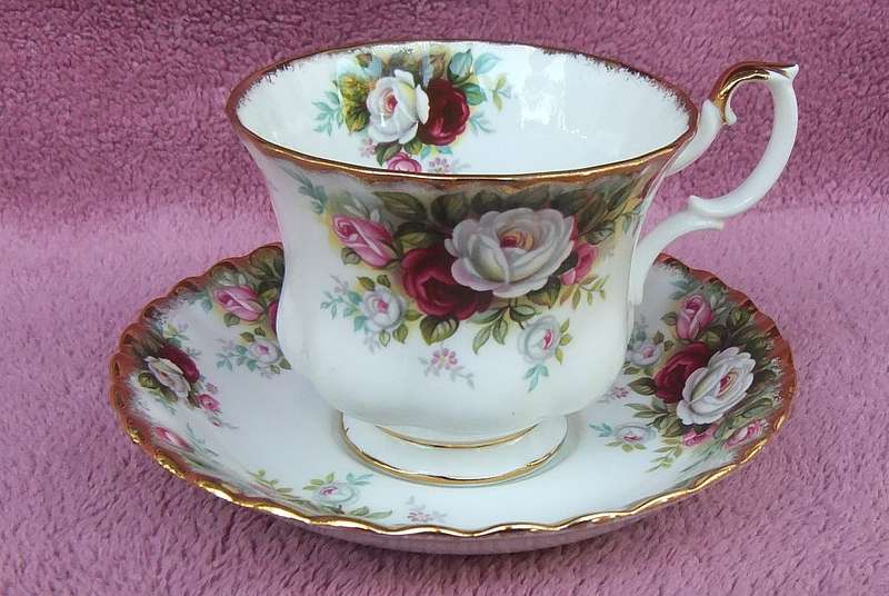 A VINTAGE ROYAL ALBERT DUO - CUP & SAUCER IN THE CELEBRATION PATTERN
