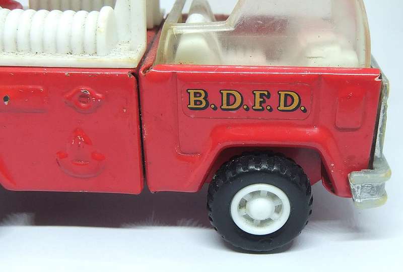 A VINTAGE MOSTLY METAL TOY FIRE TRUCK