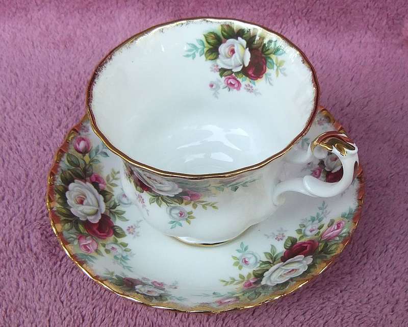 A VINTAGE ROYAL ALBERT DUO - CUP & SAUCER IN THE CELEBRATION PATTERN