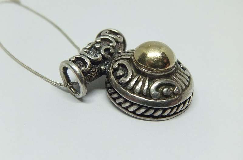 AWESOME FIND !! A SOLID STERLING SILVER PENDANT WITH GOLD ACCENT PLUS A STERLING SILVER NECKLACE !!