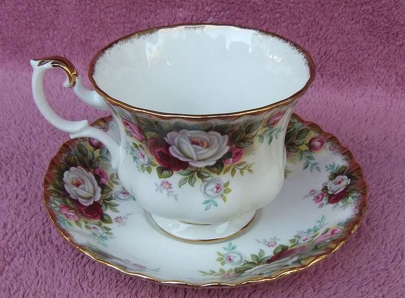 A VINTAGE ROYAL ALBERT DUO - CUP & SAUCER IN THE CELEBRATION PATTERN